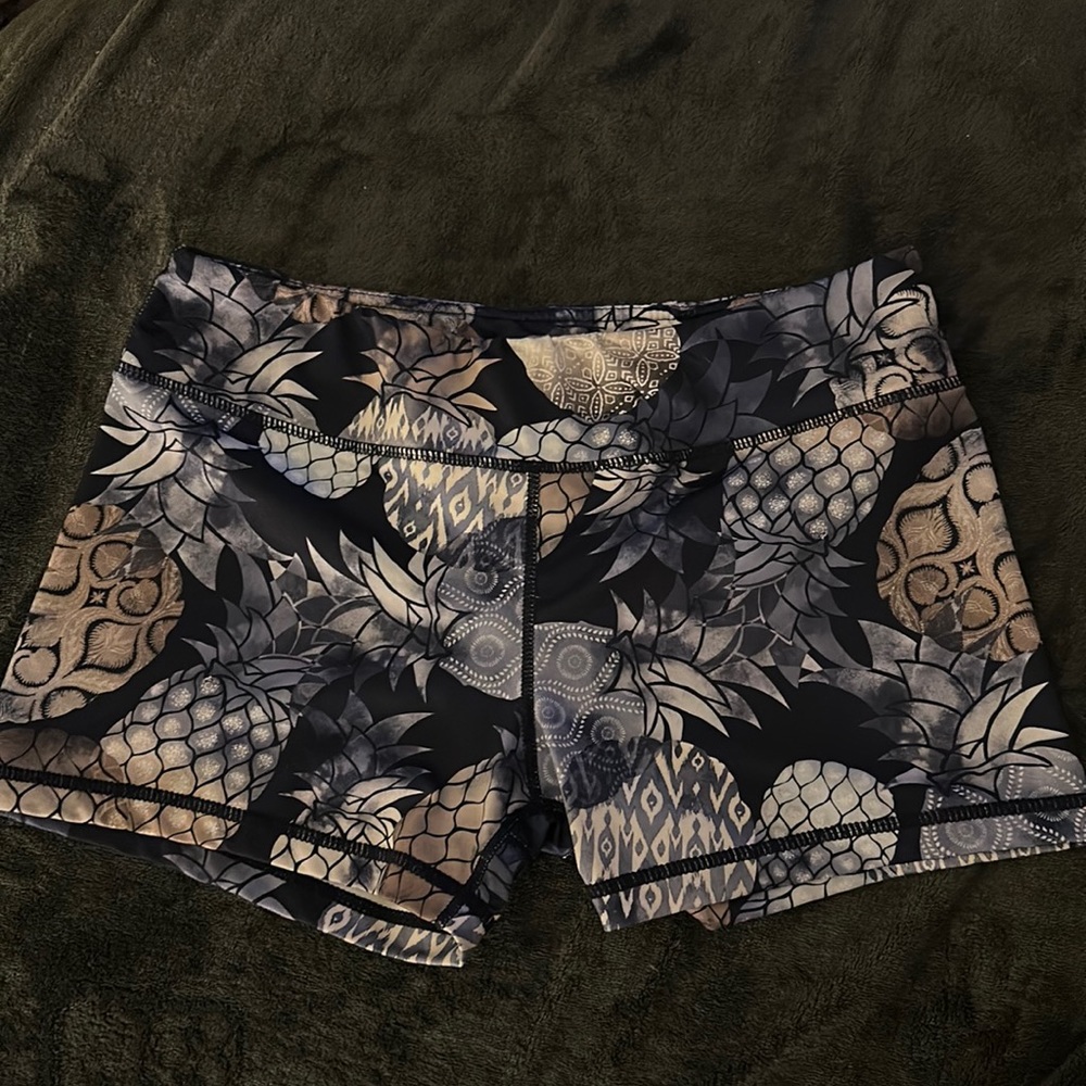 Women’s spandex short shorts, size L, blue, white and gray with pineapples.